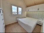 Casa Móvel "Reale II" 12x4m – Telhado a 30° com Salamandra a Pellets e Teto em Madeira (3 Quartos) - Image 12